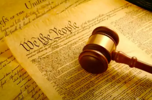 Picture of the Preamble of the United States Constitution with a gavel. 